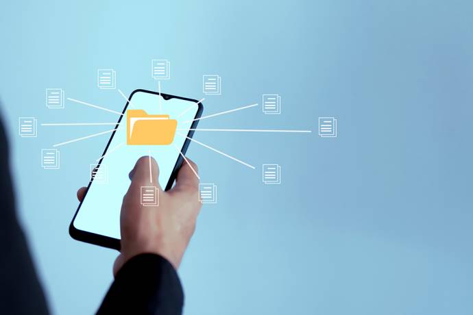 Foto: Mobiltelefon mit Akten Icon